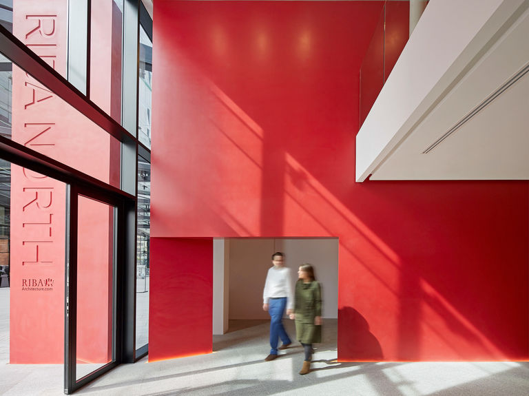 Red corian spine wall and signage sculpture at RIBA North, Liverpool.